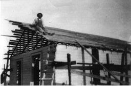 H. Page on roof of building, Dearfield, Colorado, ca. 1910s or 20s