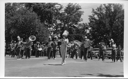 Drum major leading brass band, CSCE Golden Jubilee parade, 1940