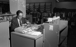 Sam Hofer in the cataloging department of Michener Library, ca 1970s