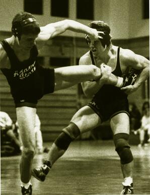 Action shot, University of Northern Colorado vs. Adams State College wrestling match, ca. 1990s.
