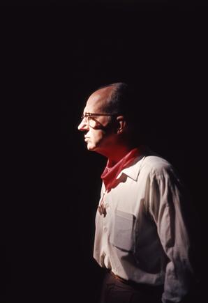 James A. Michener poses against dark backdrop in Pamplona, ca. 1960s 