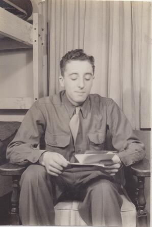WWII34AAFWTTC Albert Martin reading a letter from his mother