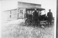 Two men in front of Dearfield Union Presbyterian Church, Dearfield, CO, ca. 1910s?