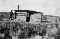 Man outside log cabin, Dearfield, Colorado, ca. 1910s?