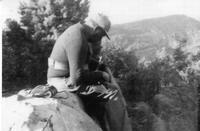 Charles Rothwell sitting on rock