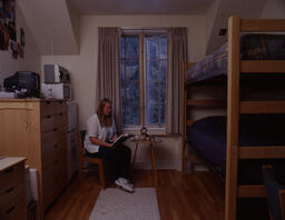 Student reading in dorm room