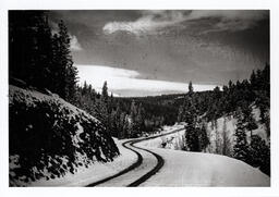 [Winding, snow-covered road]