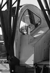 Worker operating heavy machinery at the construction site of the University Library, early 1970s