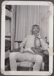 WWII08AAFWTTC Earl Godwin wearing a gas mask