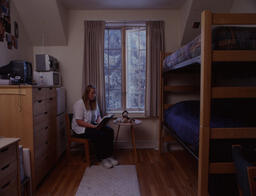 Student reading in dorm room