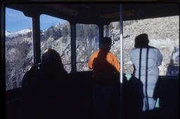James Michener and two unidentified people in Jackson Hole Aerial Tram, Wyoming, 1977