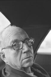 James A. Michener seated in an automobile