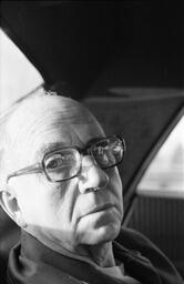 James A. Michener seated in an automobile